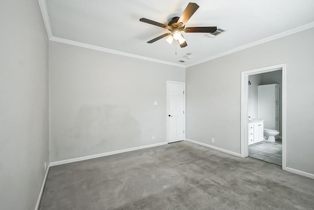 unfurnished bedroom featuring crown molding, ensuite bath, ceiling fan, and carpet floors