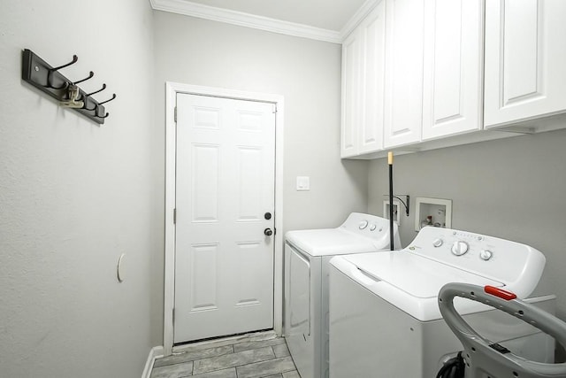 clothes washing area featuring cabinets, ornamental molding, and independent washer and dryer