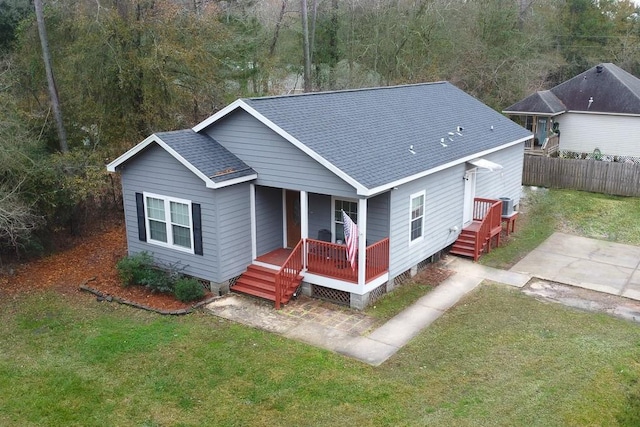 rear view of house with a lawn