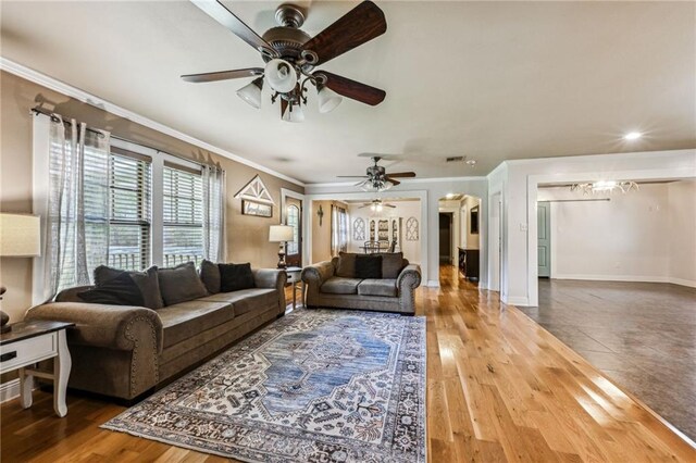 living room with hardwood / wood-style flooring and ceiling fan