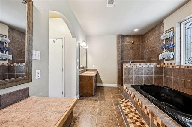 12119 Acey Allen Rd, Independence, LA 70443 - carpeted bedroom with arched walkways, lofted ceiling, visible vents, ceiling fan, and baseboards