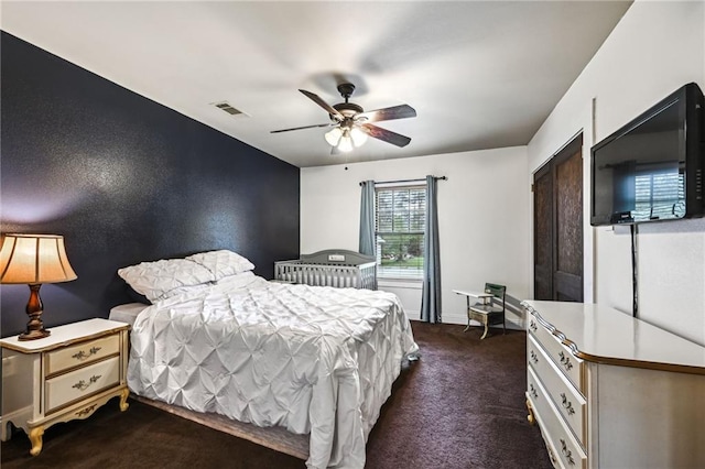 carpeted bedroom with ceiling fan