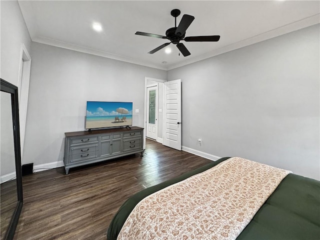 bedroom featuring ceiling fan, ornamental molding, and dark hardwood / wood-style floors