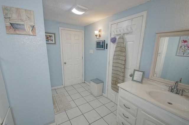 bathroom featuring vanity and tile patterned flooring