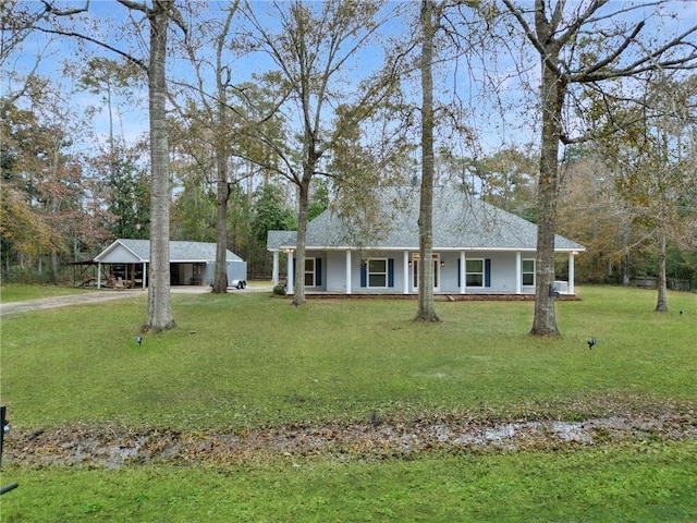 ranch-style house featuring covered porch, a front lawn, and a carport