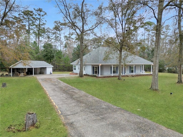 ranch-style home with a porch, a carport, and a front yard