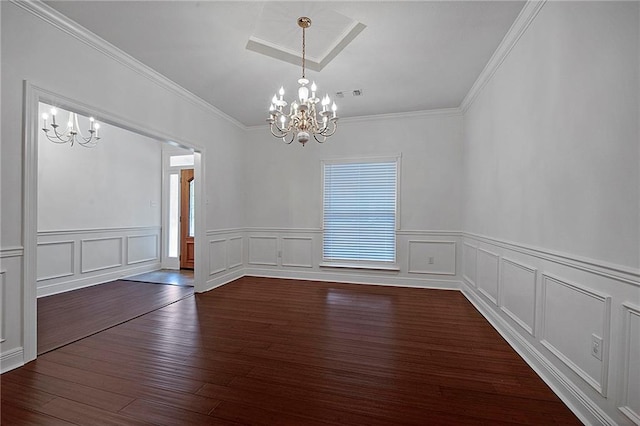 unfurnished dining area with visible vents, a chandelier, dark wood-type flooring, and ornamental molding