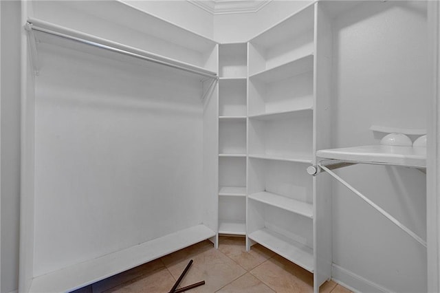 spacious closet featuring light tile patterned flooring