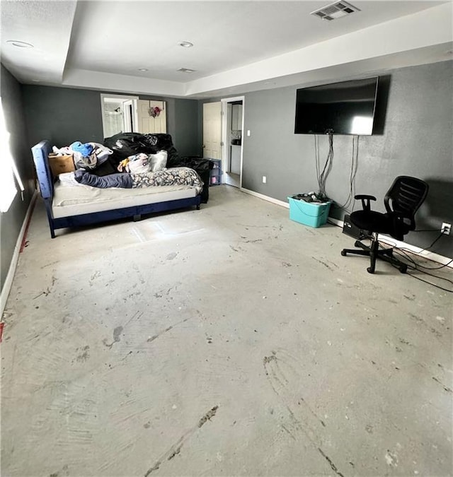 bedroom featuring concrete floors