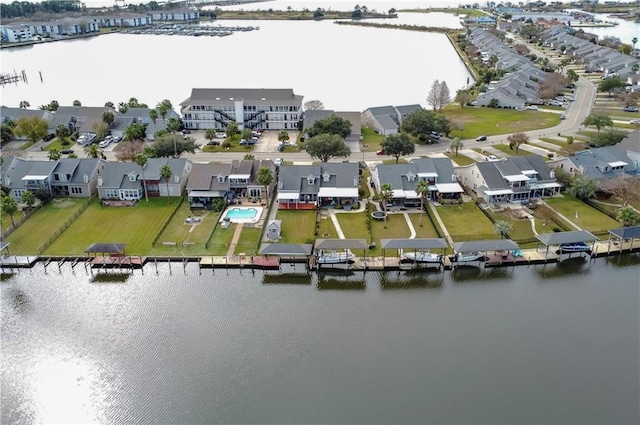 bird's eye view featuring a water view and a residential view