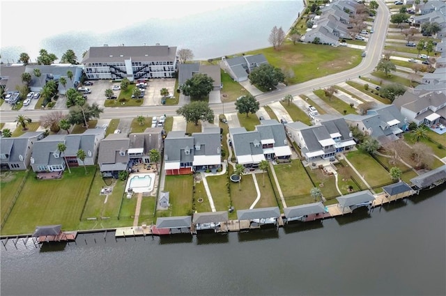 birds eye view of property featuring a residential view and a water view