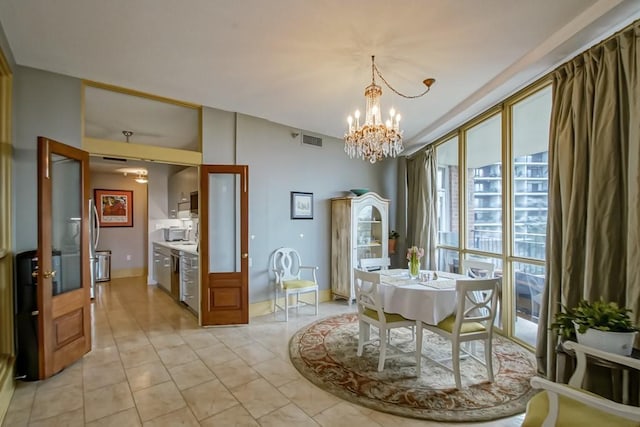 dining area with expansive windows, light tile patterned floors, and an inviting chandelier