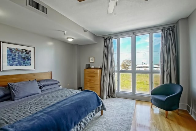 bedroom featuring ceiling fan and hardwood / wood-style floors