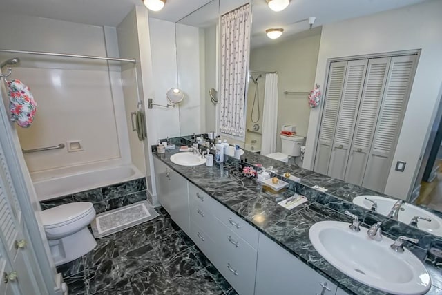 full bathroom with vanity, bathtub / shower combination, and toilet