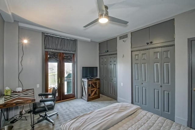 carpeted bedroom featuring multiple closets, ceiling fan, french doors, and access to outside