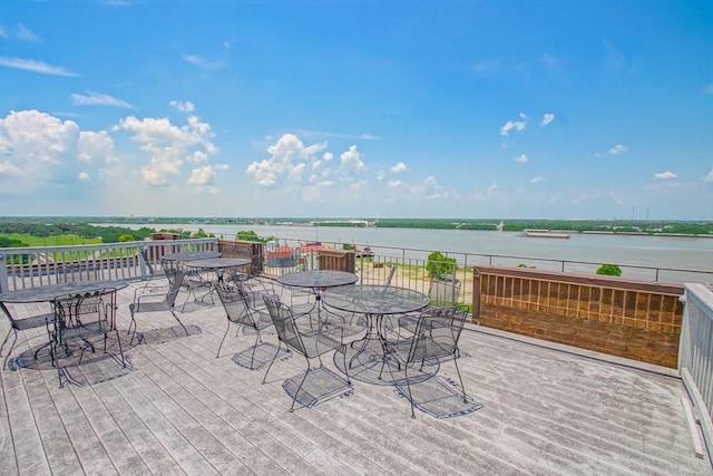 view of patio featuring a deck with water view