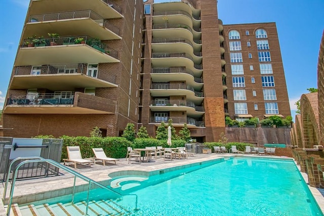 view of swimming pool with a patio area