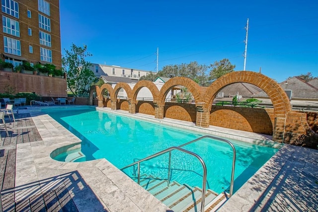 view of swimming pool featuring a patio area