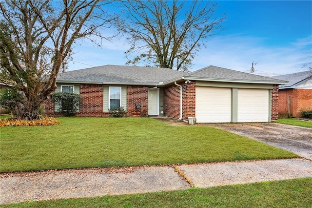 single story home featuring a garage and a front yard