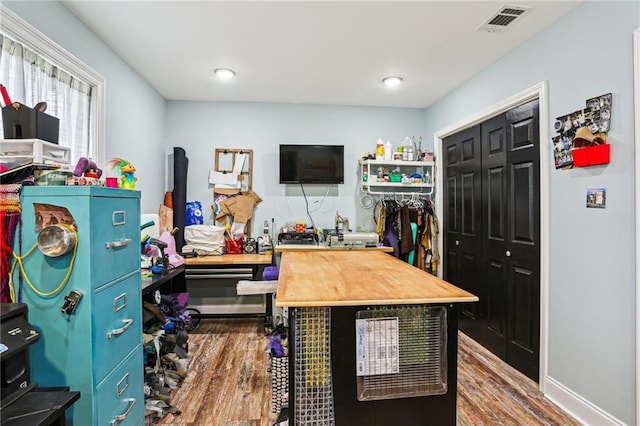 home office featuring hardwood / wood-style floors