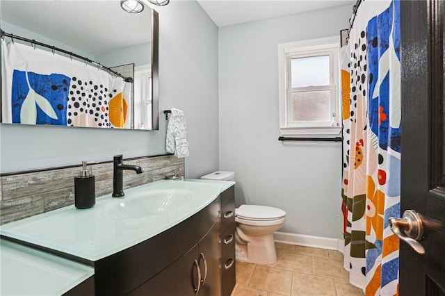 bathroom featuring vanity, a shower with curtain, tile patterned floors, and toilet