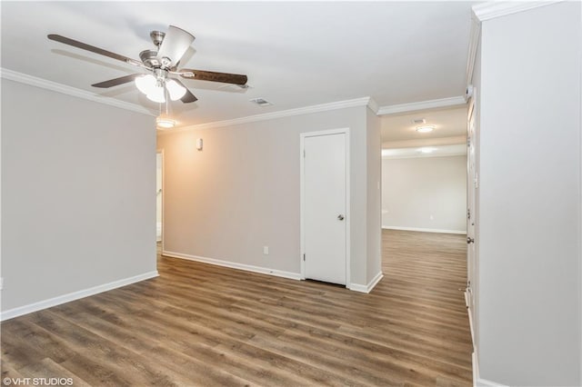 empty room with crown molding, dark hardwood / wood-style floors, and ceiling fan