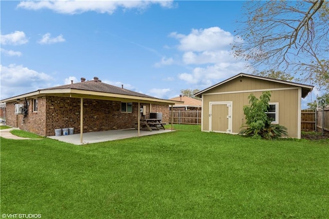 rear view of property with a shed, a patio area, and a lawn