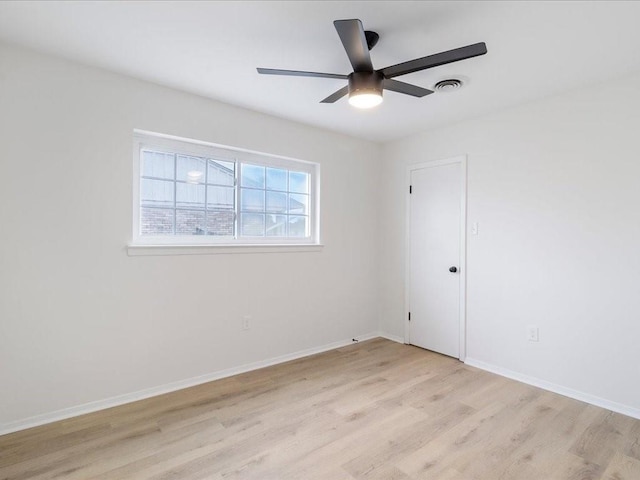 empty room featuring ceiling fan and light wood-type flooring