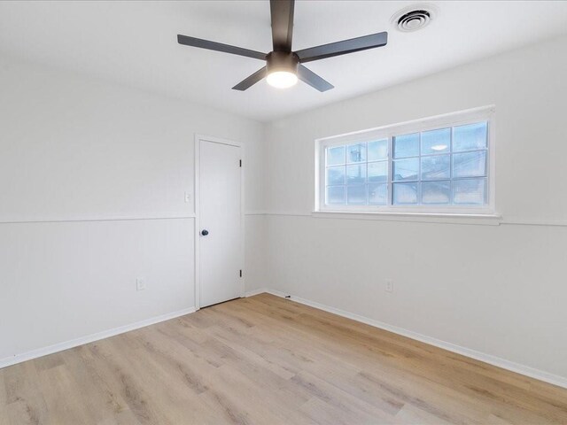 unfurnished room with ceiling fan and light hardwood / wood-style flooring