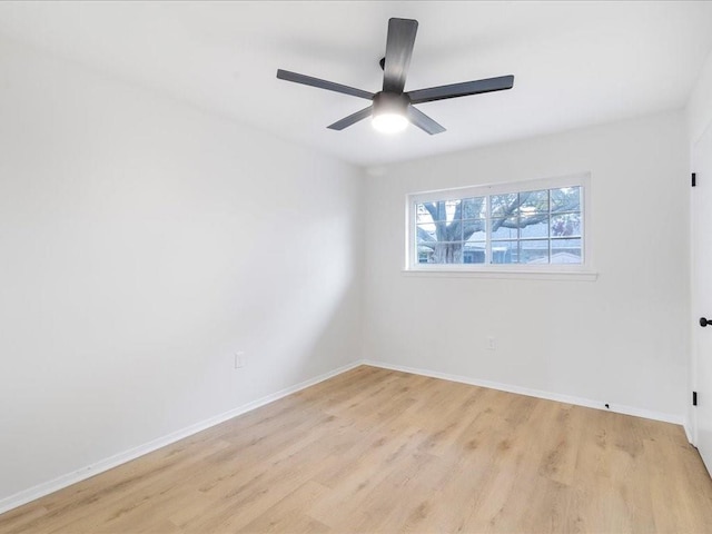 empty room featuring light hardwood / wood-style floors and ceiling fan