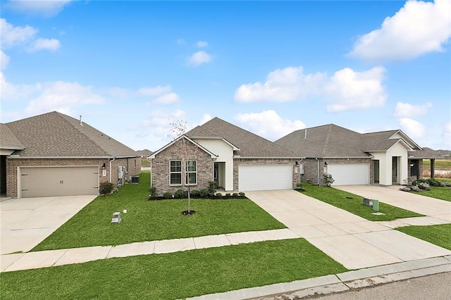 view of front of home featuring a garage and a front lawn