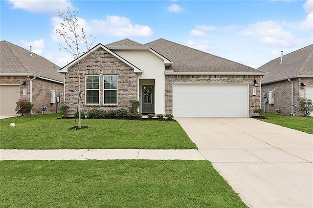 view of front of home featuring a garage and a front lawn