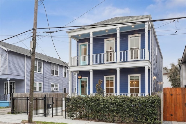 view of front of home featuring a balcony and covered porch