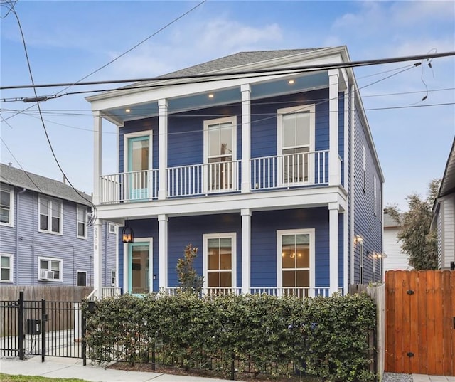 2308 Amelia St, New Orleans, LA 70115 - view of front of home featuring a porch, fence, and a balcony
