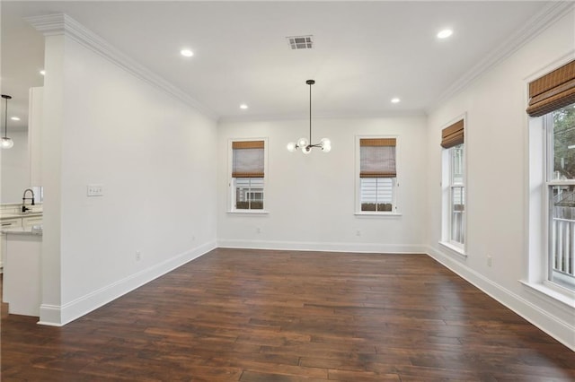 interior space featuring crown molding, dark hardwood / wood-style flooring, sink, and a notable chandelier