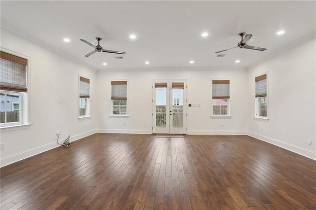 unfurnished room with dark wood-type flooring, ceiling fan, and ornamental molding