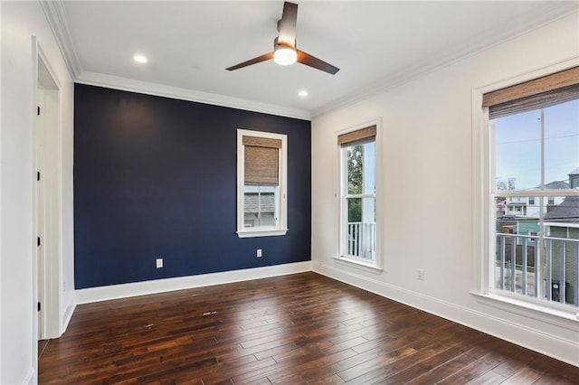 spare room featuring ornamental molding, dark hardwood / wood-style floors, and ceiling fan