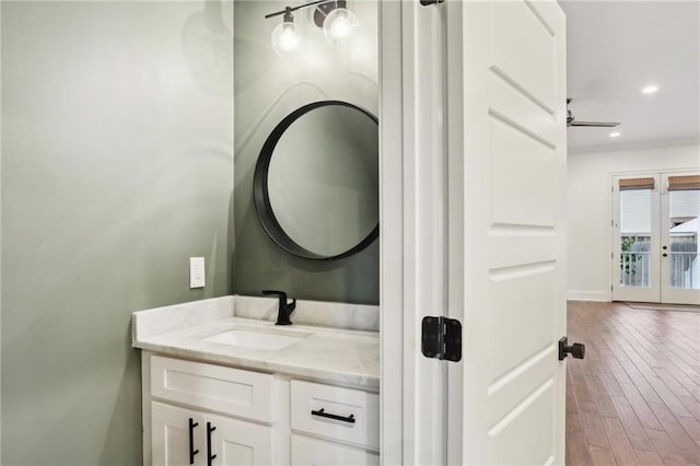 2308 Amelia St, New Orleans, LA 70115 - bathroom with vanity, baseboards, recessed lighting, french doors, and wood finished floors
