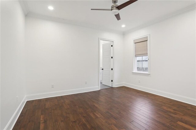 spare room with crown molding, ceiling fan, and dark wood-type flooring