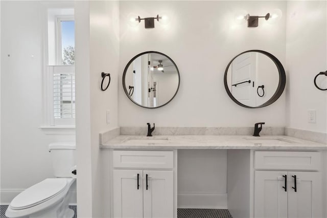 bathroom featuring vanity and toilet