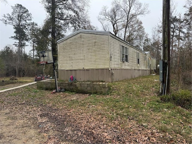 view of side of property with cooling unit