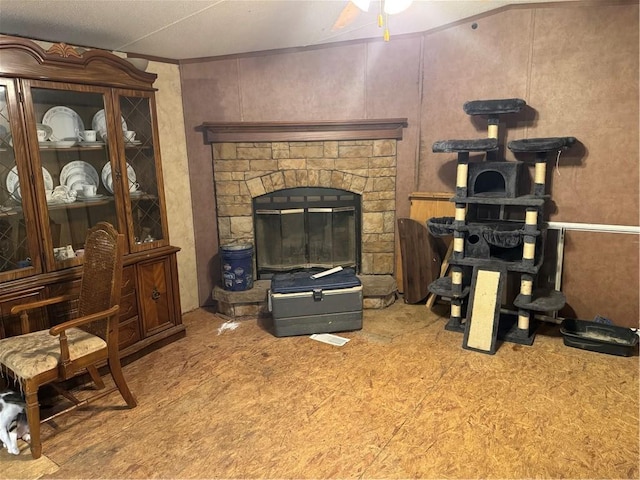 living room with a fireplace and ornamental molding