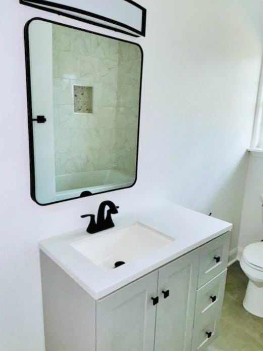 bathroom with vanity and toilet