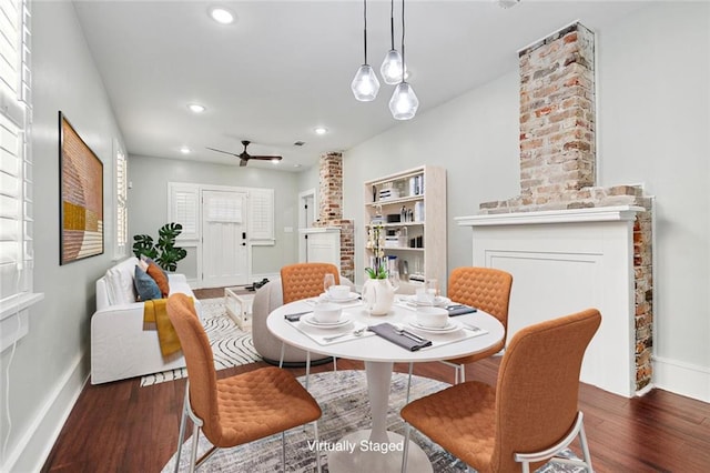 dining space featuring recessed lighting, baseboards, and wood finished floors