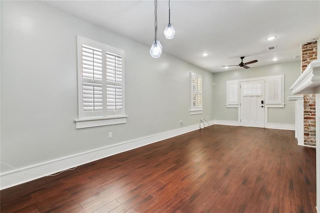 unfurnished living room with visible vents, baseboards, ceiling fan, wood finished floors, and recessed lighting