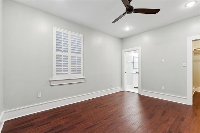 spare room with ceiling fan, recessed lighting, wood finished floors, and baseboards