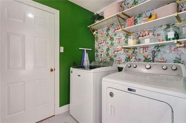 office featuring washer / dryer, a textured ceiling, and light hardwood / wood-style flooring