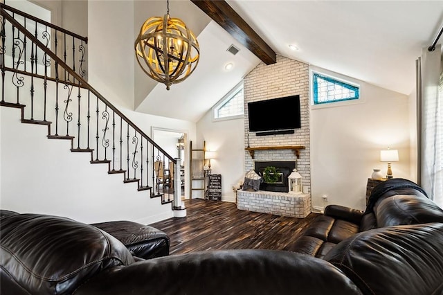 living room with a healthy amount of sunlight, beam ceiling, hardwood / wood-style floors, and a brick fireplace