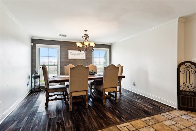 dining room featuring hardwood / wood-style flooring and crown molding