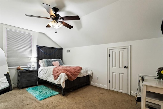 carpeted bedroom with ceiling fan and lofted ceiling